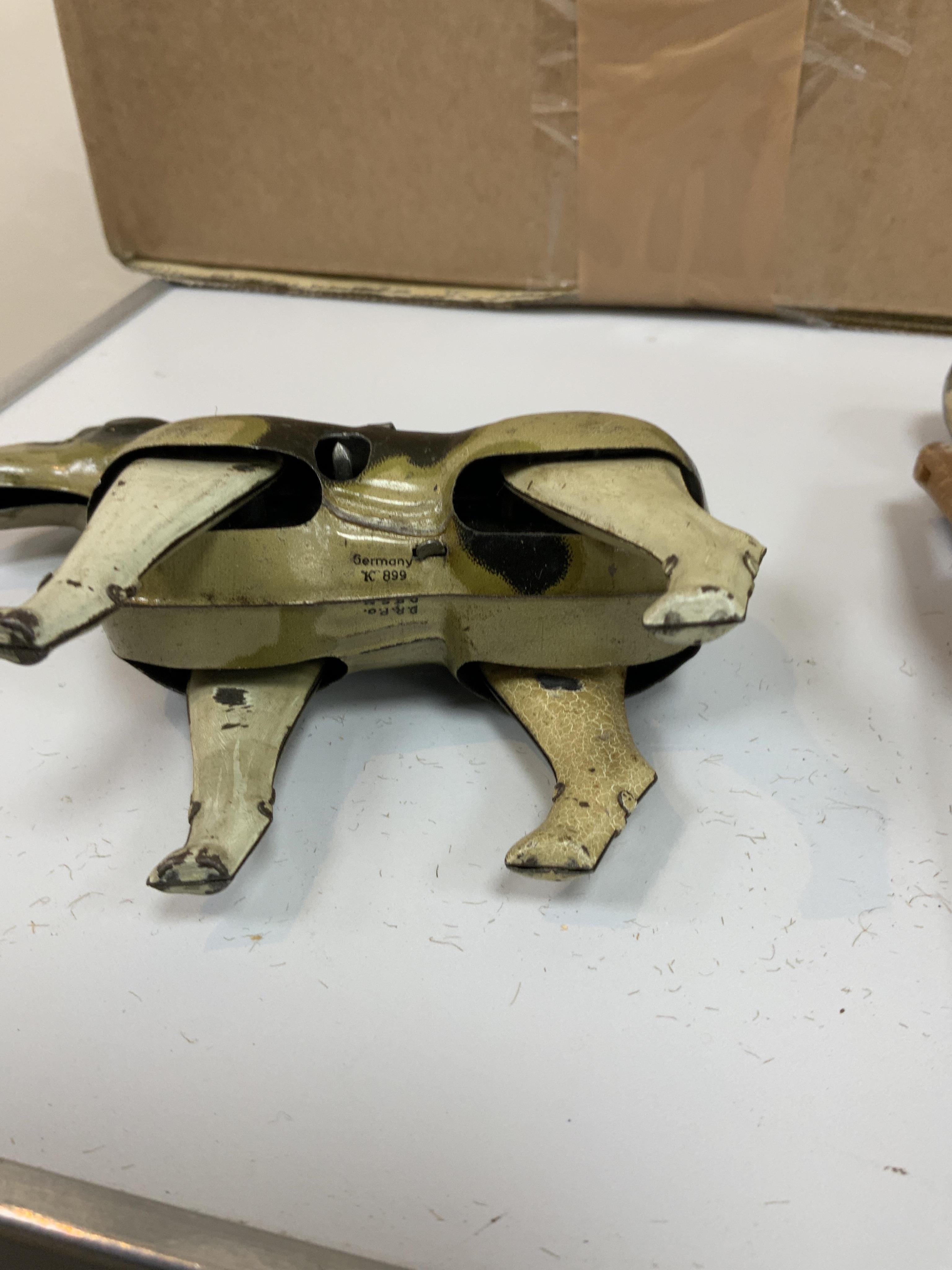 A Schoenhut Humpty Dumpty Circus, early 20th century, including elephant, lion house and other pieces, a playbarn (10) plus a peg doll and a German tinplate clockwork dog